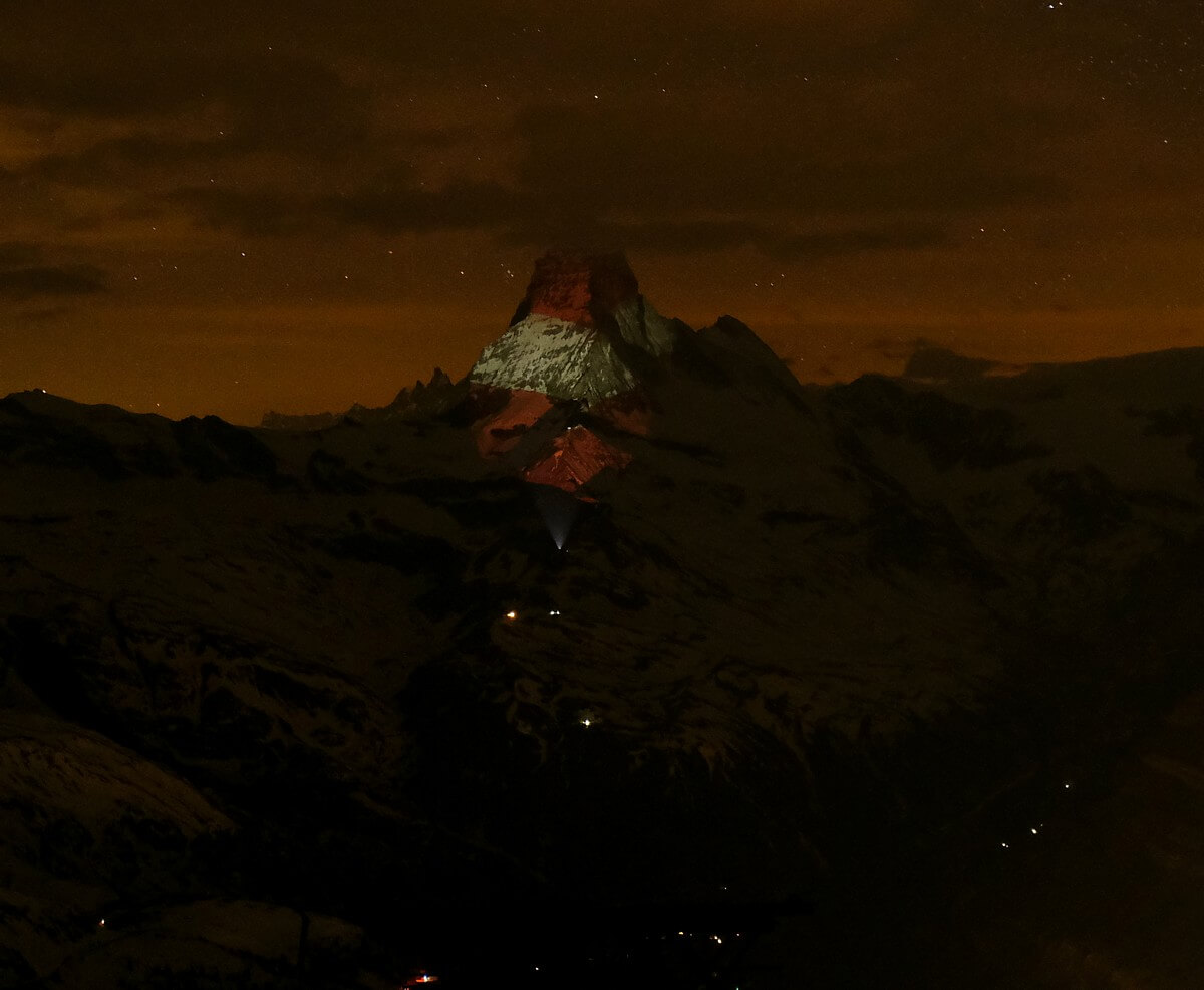 TopskiresortCom's tweet photo. Swiss Mountain #Matterhorn Has Been Illuminating With Flags Of Countries Affected By #Coronavirus
#SwitzerlandFlag #AustriaFlag #GermanyFlag #UnitedKingdomFlag #Zermatt @zermatt_tourism https://t.co/cDIJ3JsvrE