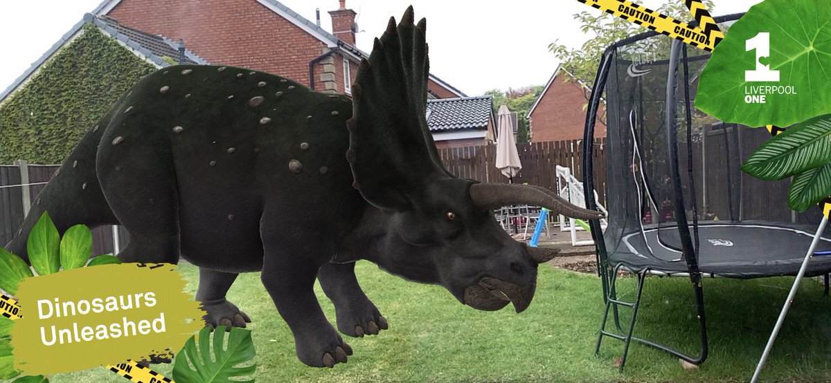 roz_lloydy's tweet photo. When you find a dinosaur in your garden trying to eat the trampoline! Thanks @Liverpool_ONE for a great rainy day activity (and educational - always a bonus while ‘homeschooling’) #DinosaursUnleashed https://t.co/CvNmCDY3vI