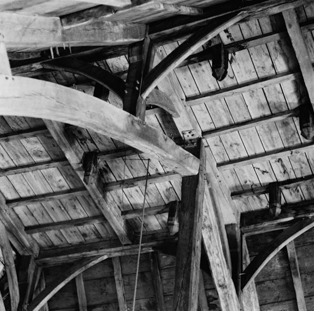 this is even more true of the interior: the roof is a complex piece of timber that recalls shipbuilding techniques and forms of medieval carpentry having a kind of strange last gasp in the New World, brought over by colonist carpenters