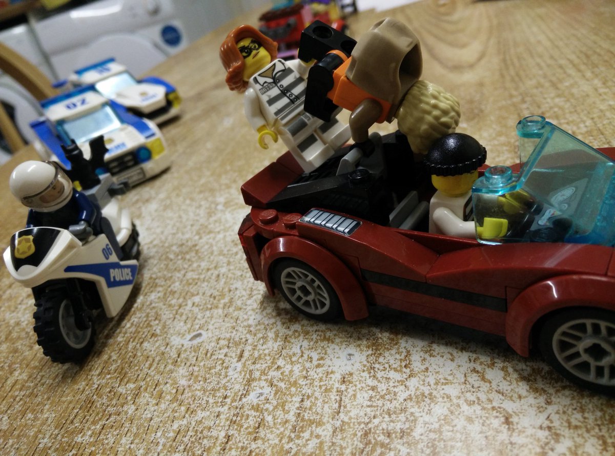 Every night before bed, my son sets up a  #Lego scene on the kitchen table. It's always a freeze frame of a high-octane action scene. Always lots to unpack. My favourite part of this one is the cop turning his head to look.