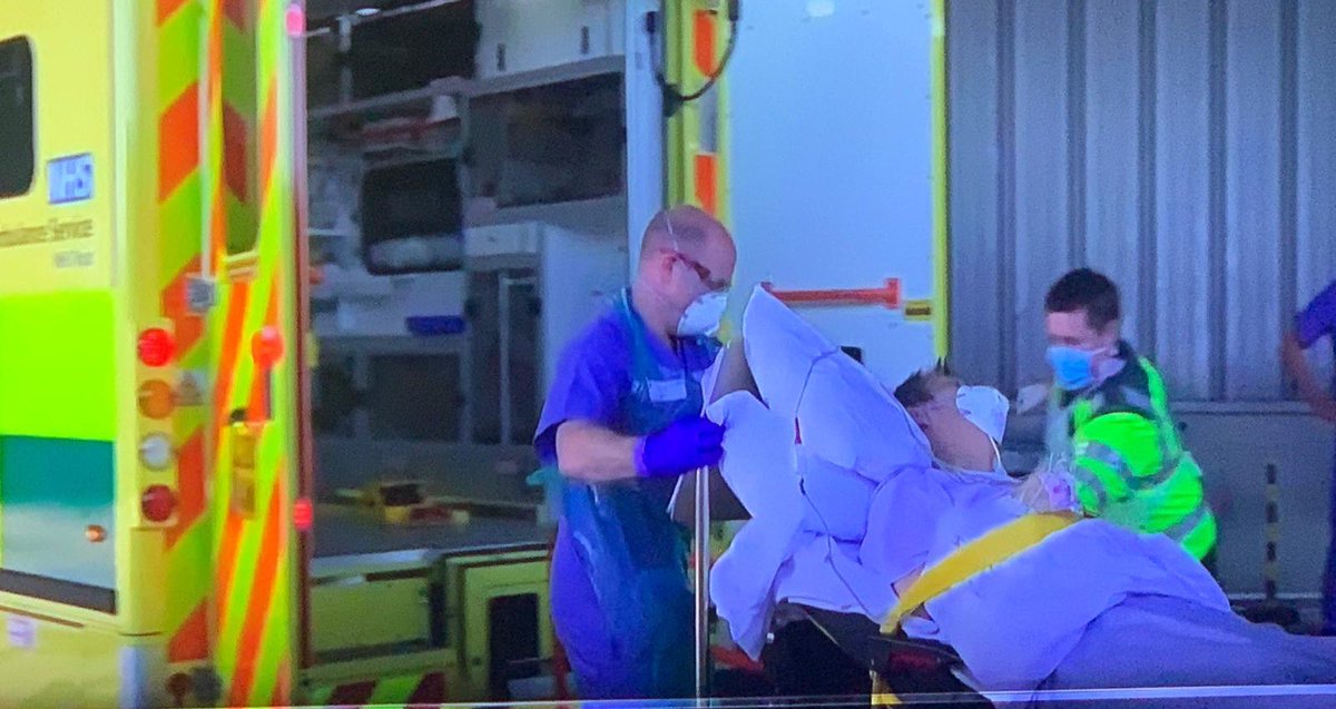 NBS_Herts's tweet photo. This picture shows the first patient leaving the nightingale hospital after recovering from Covid 19. The paramedic is Joe Haines former NBS student he places others before himself: helping the sick. #faithinaction #supernbsproud  #thankyouJoe https://t.co/FqfM2JhbYp