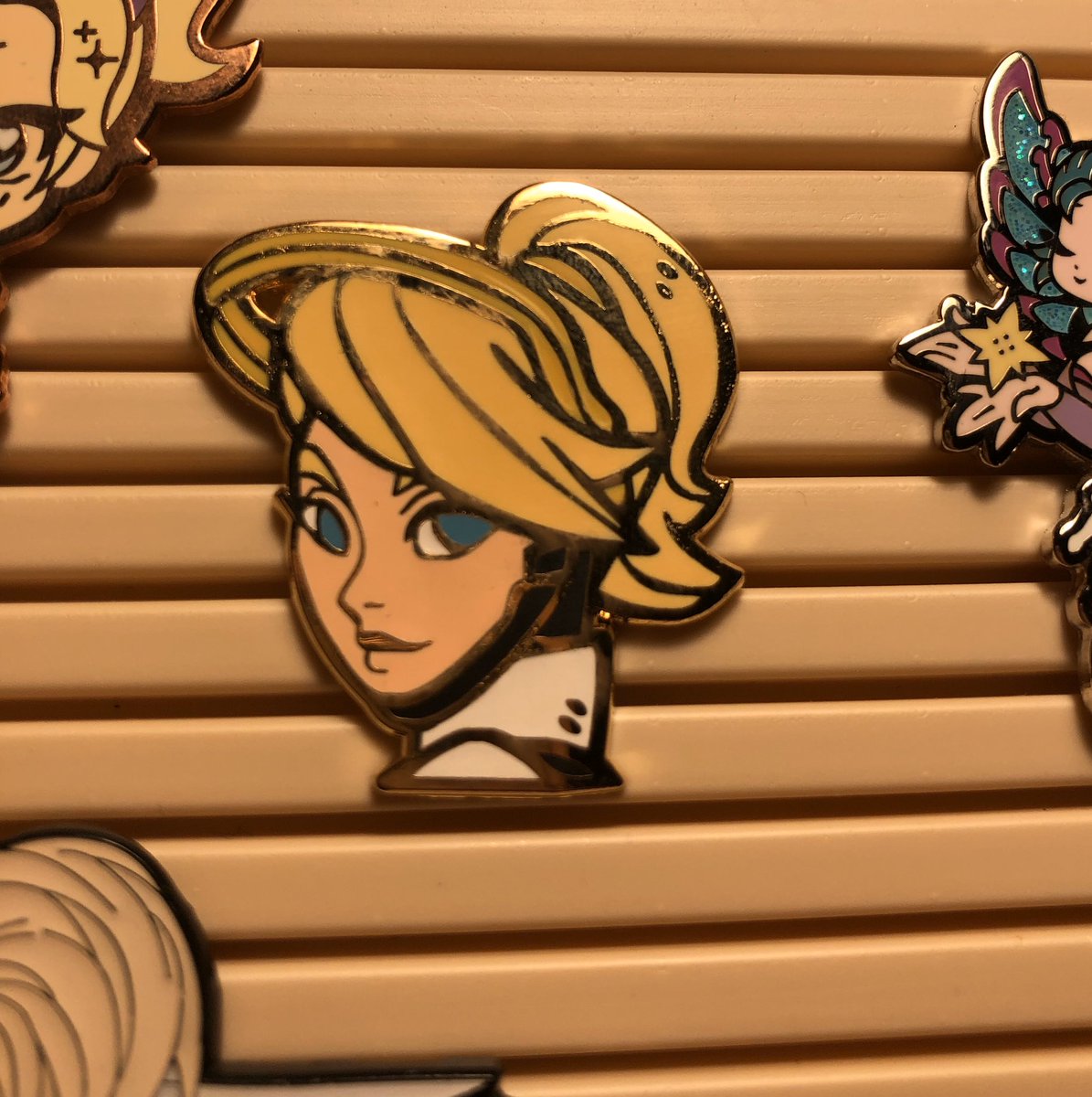 healingrosebuns's tweet photo. new pins! Isn’t Mercy loving #pocky canon? anyway I love my evergrowing pin collection #mercymain #supportmain #overwatchcollection #enamelpins https://t.co/nijqmcyAoO
