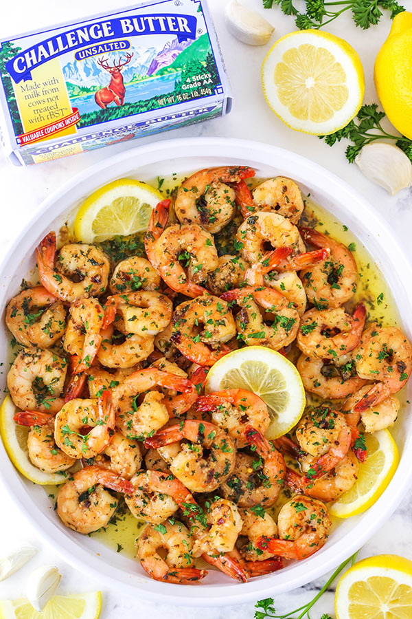 Garlic Butter Shrimp Scampi made with <a href="/challengedairy/">Challenge Dairy</a> butter! #AD An addicting garlic buttery sauce with a little lemon in it! Plus, you can have it ready to go in about 20 minutes! The perfect appetizer or meal! lifeloveandsugar.com/garlic-butter-… #challengebutter #MadewithChallenge #recipe
