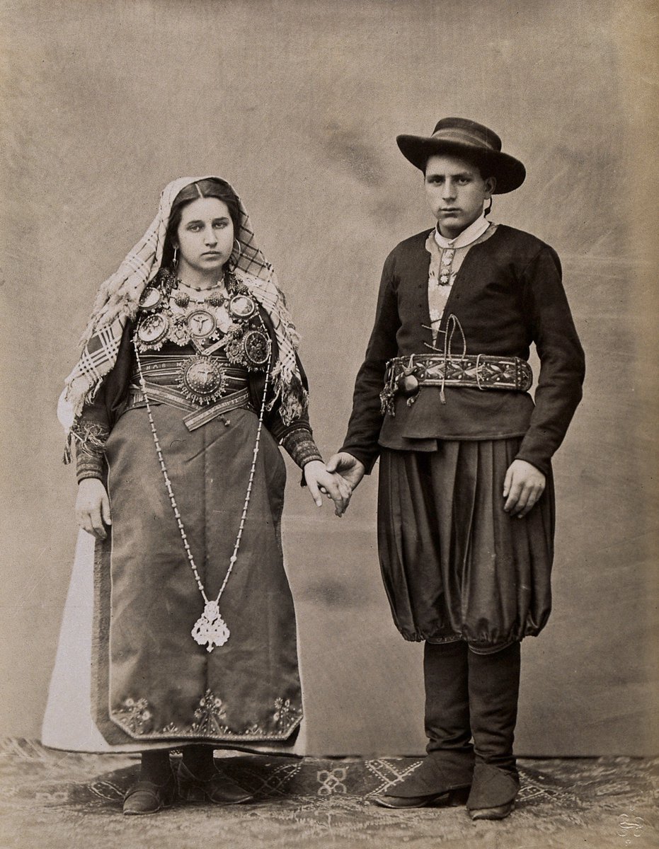 People of Leon, Spain, a young man and woman holding hands, wearing traditional dress. Photograph by J. Laurent, ca.1880.