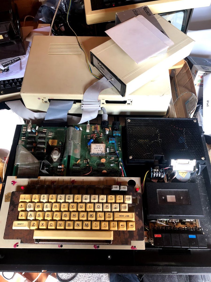 andrewhague's tweet photo. Not very tidy - but I've powered up the old EACA VideoGenie from my loft after 18 years of stasis. Still working... @SimonNGoodwin @simondotm #videogenie #RetroComputing #vintagecomputer #eg3003 #eaca #system80 https://t.co/9oBZzulM3f