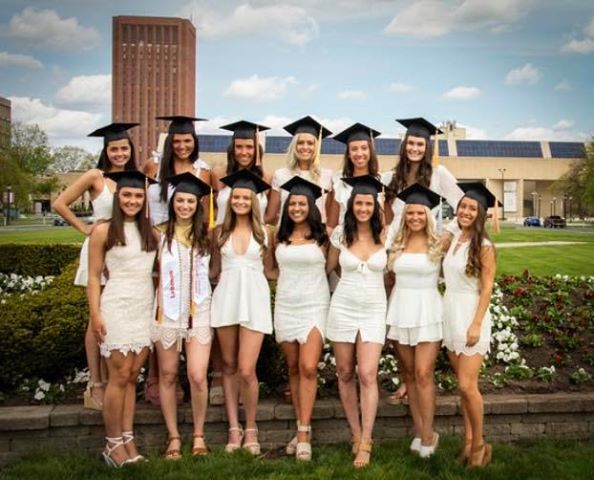 UMassAmherst's tweet photo. These roommates, who have been quarantining together for months, decided to host their own commencement ceremony—complete with appropriate social distance measures and a parade from their proud families! https://t.co/6CIUqEG4SZ

[📸: Abby Connolly] #UMass2020 #UMassTogether https://t.co/iCvXzIYzBt