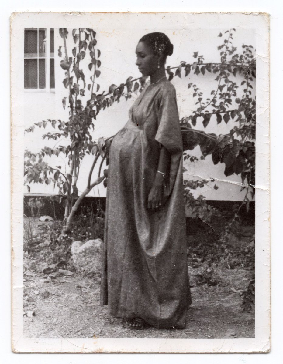 RhetoricAndThis's tweet image. Poems by me, cover painting by my talented father: A portrait of my late mother, Hauwa Tini Adamu Geter—a Nigerian Muslim woman who immigrated to America at the age of 29 with two small children. @weslpress  bit.ly/UNAMERICAN