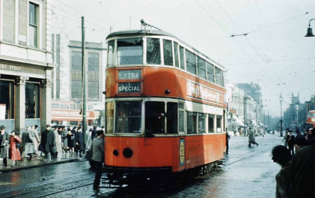 Jumping on a tram in the 1950’s outside of where the Archway Tower is today. To the left of the photo is the Archway Tavern, in the far distance St John’s Church in upper Holloway can be seen.