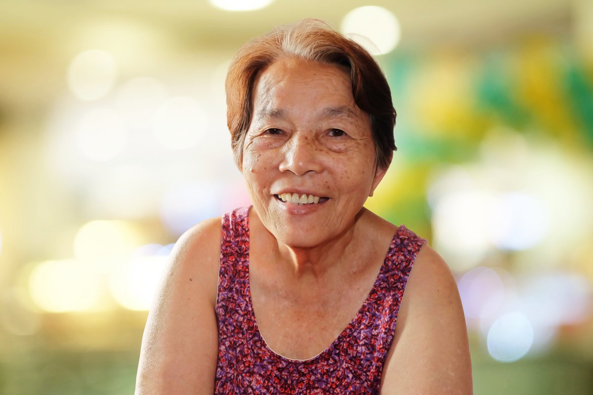 A smiling older Asian-American woman. 