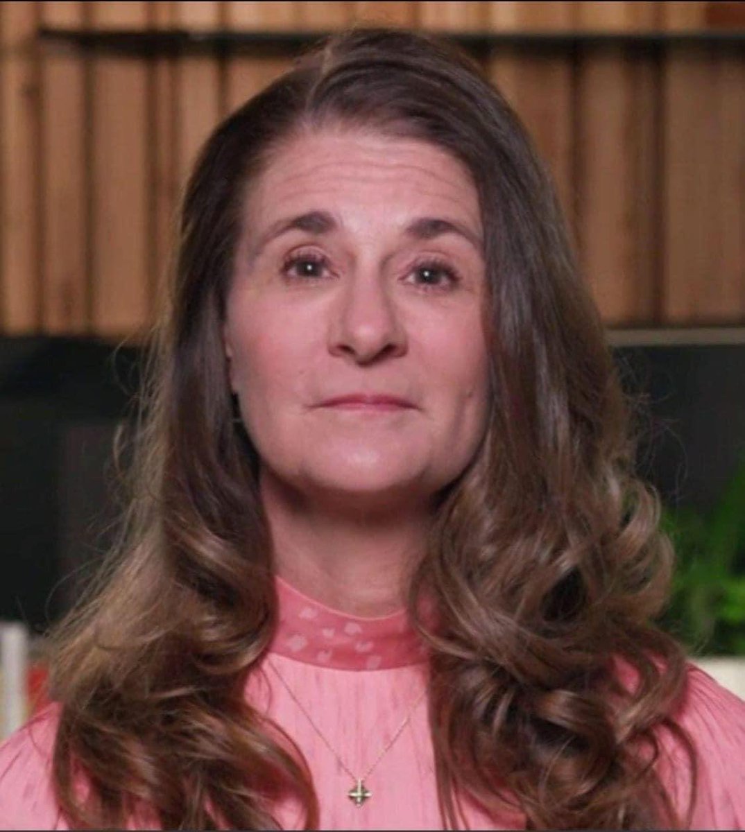 Melinda Gates with upside down cross necklace. 