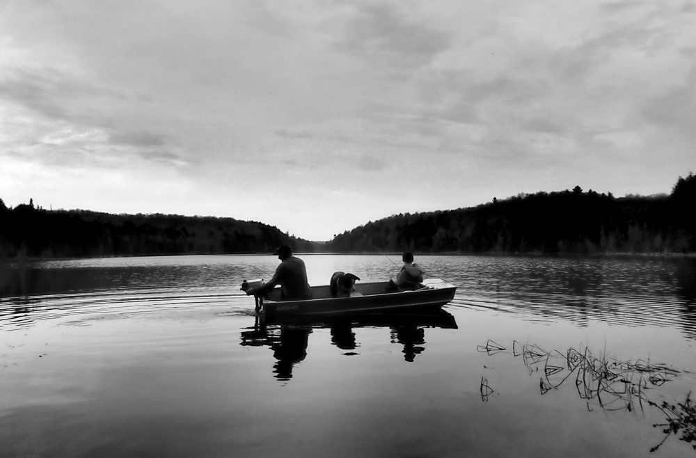 NorthernGinny's tweet photo. I took this picture in #DorsetON on Mother's Day weekend 2015. Tim, Jake, and Tucker in our little tin boat. #ItsNotAboutTheFish https://t.co/ERtDllTWxq