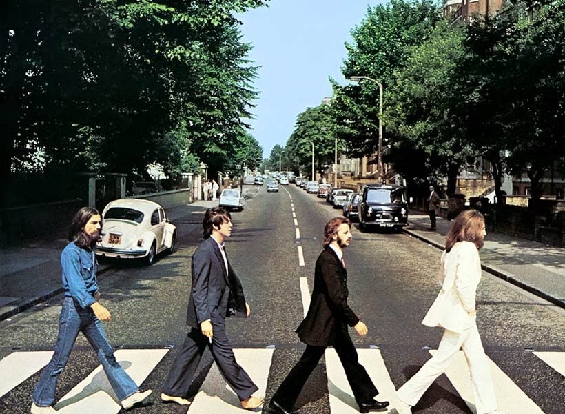 - here we have the cover of abbey road. they claim that the picture was taken very quickly, it was a coincidence how they all synced. it’s actually not. they took 4 different pics of paul and photoshopped them as one person.