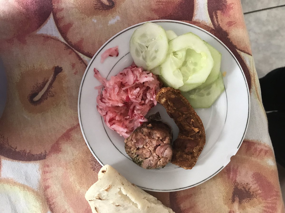 Not necessarily super Guatemalan but a meal of fresh chicharrón, sausage, red cabbage, Cucumbers, tortilla  (not picture: chirmol)