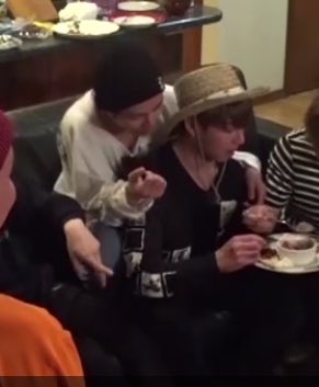 taehyung feeding a sleeping jungkook french fries when they were watching a dorama together