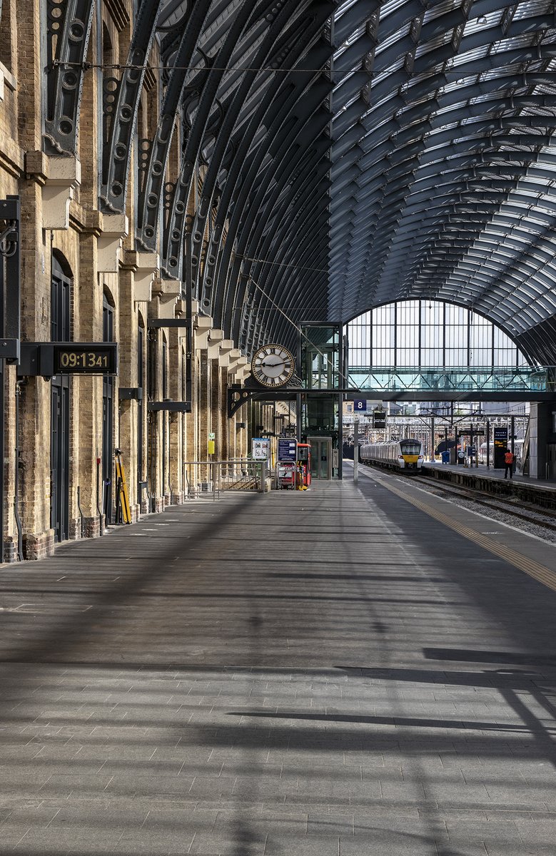 Inside King's Cross station, peace returns after a train leaves.