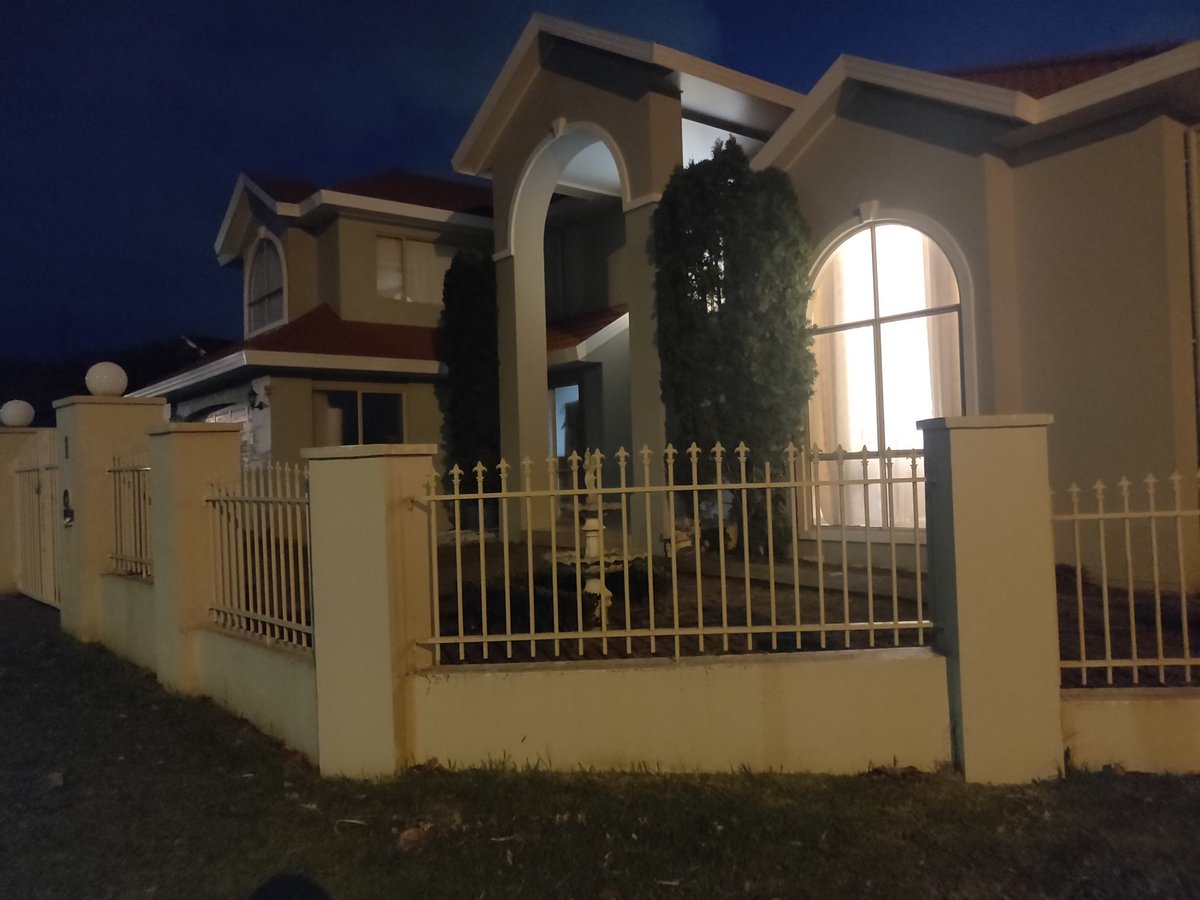 Today's theme is "hideous McMansions with godawful pillars"(I have made peace with being the bearded guy who takes photos of people's homes at night)