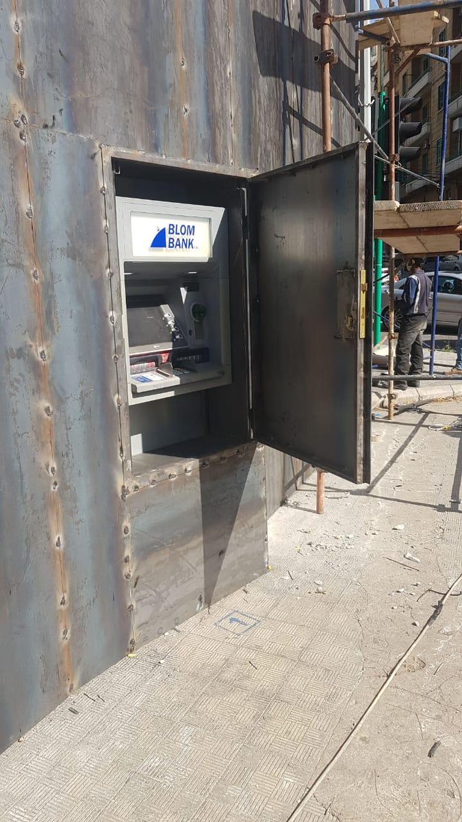 KarlreMarks's tweet photo. This bank in Lebanon asked to install a pay wall. Someone took the instruction literally. https://t.co/Nr9KN3Yiu6