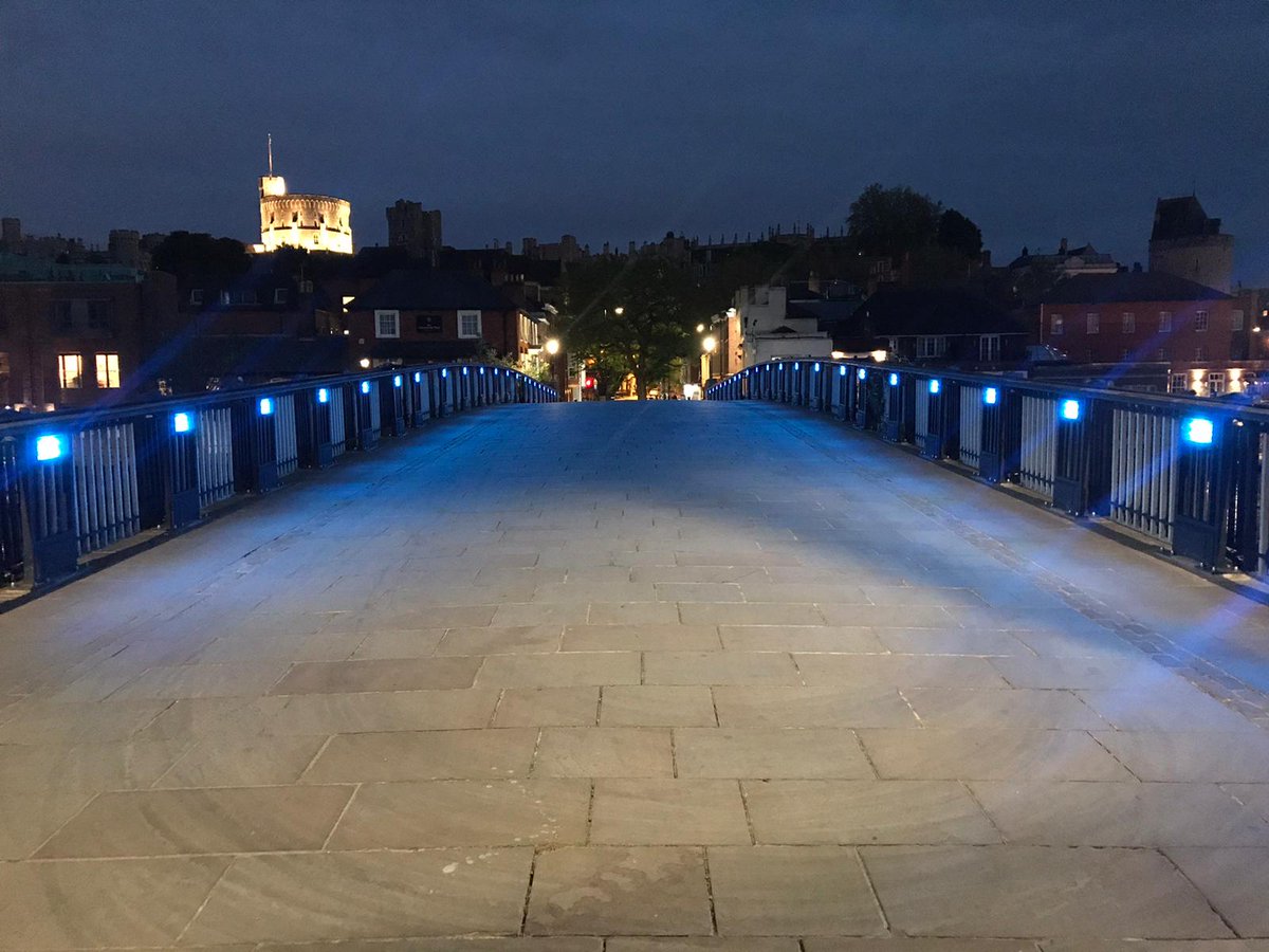 RBWM's tweet photo. Windsor Bridge will be lit blue every evening, sponsored by @RBWM contractors Serco and Tivoli. Pictured is the bridge from the Eton side with Windsor Castle in the background. The sponsored lighting is in support of NHS and other key works dealing with the COVID-19 crisis. https://t.co/9JN7281c6G
