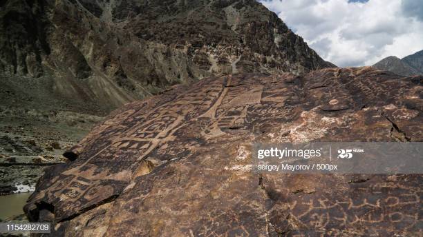 belonging to two or three millennia BCE. The third group includes engravings prior to Kushan, mainly in the Chilas region, and shows images of stupas and anthropomorphic figures. Finally, the fourth group includes stupas, temples, phallus symbols, circles and