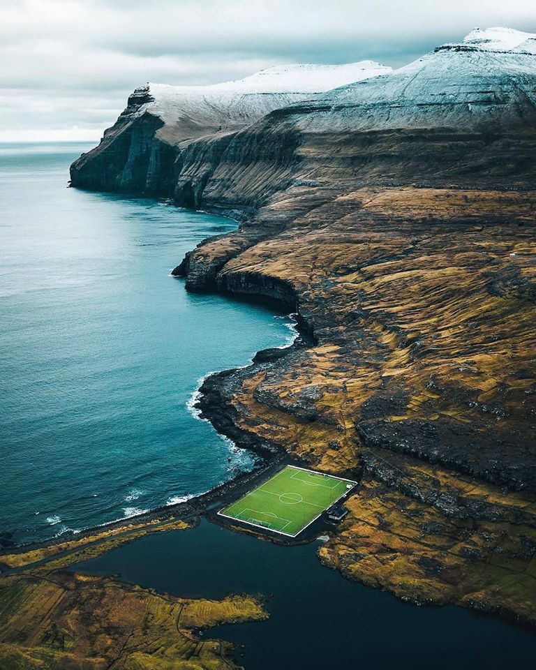 6. Eidi Stadium, Faroe Islands – Another Scandinavian wonder, Eidi sits next to the Atlantic Ocean (tougher conditions than a cold Tuesday night in Stoke). The pitch lies on the irregular eroded surface of the Palaeocene and Eocene Middle Basalt Series. Photo: Visit Faroe Islands