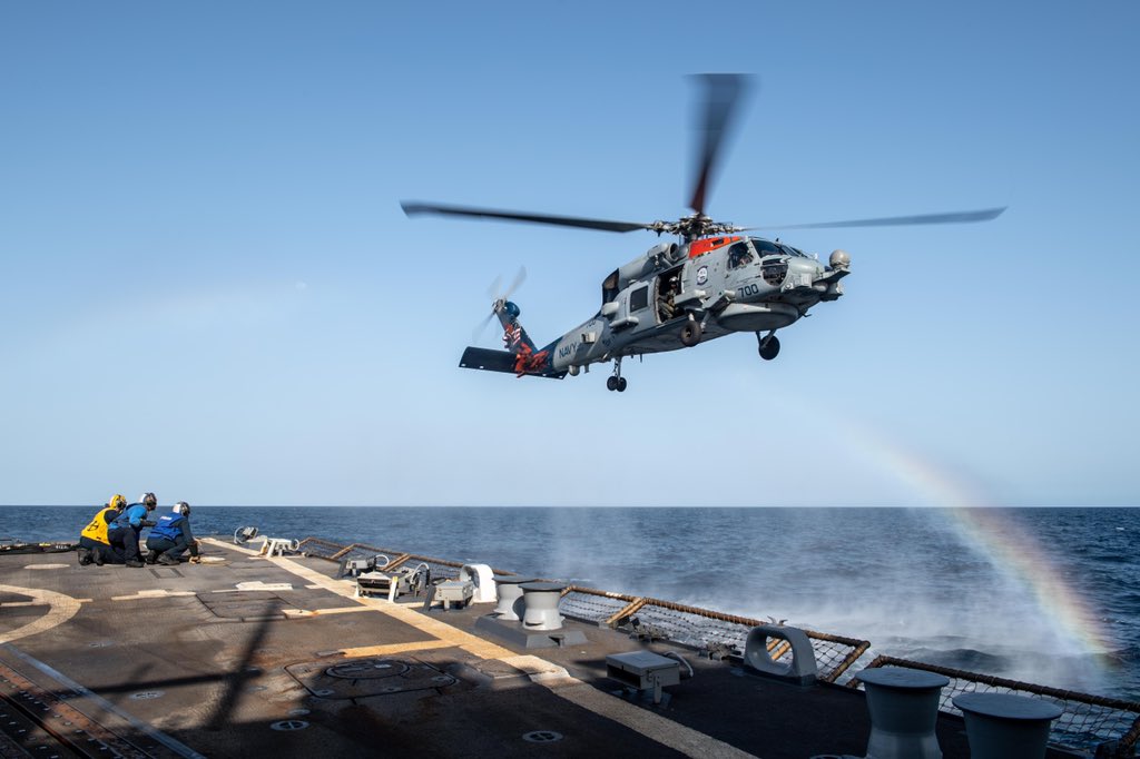 Somewhere Over the Rainbow. #HSM74 Swamp Foxes flies above a rainbow as #USSTruxton Sailors prepared to conduct a simulated helicopter in-flight refueling.  
Truxton is deployed, supporting naval operations in @US5thFleet & @CENTCOM areas.