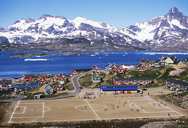 10. Tasiilaq Stadium, Greenland – It may not have actual grass (not-so green land), but it occupies the largest piece of flattened land in the area. The 1.7 Ga Ikaasartivaq intrusive complex of gabbroic to granitic intrusions forms the backdrop. Photo: Football Stadium (Facebook)