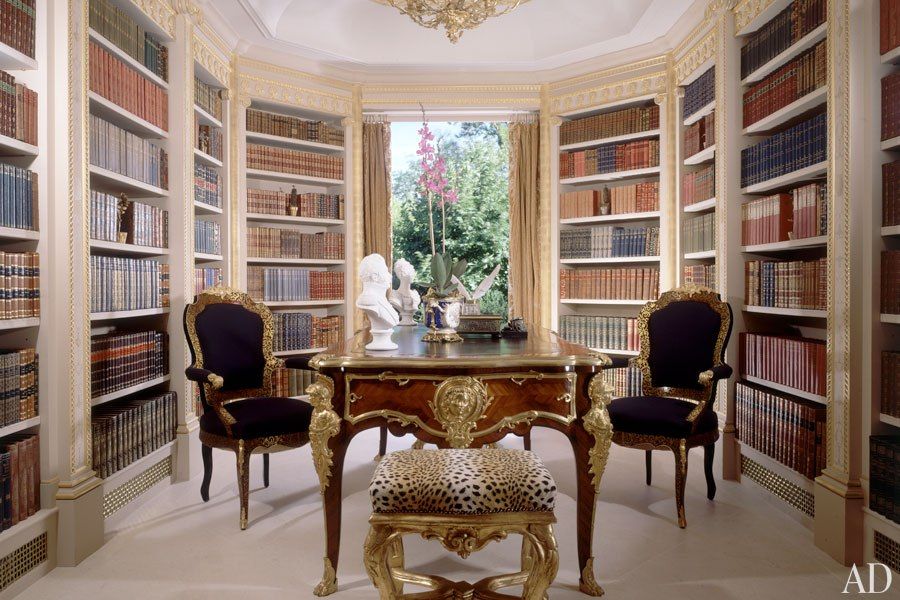 ....and this is the library in Elton's London home, with some pleasing "gilt 'n leopard skin" accents.