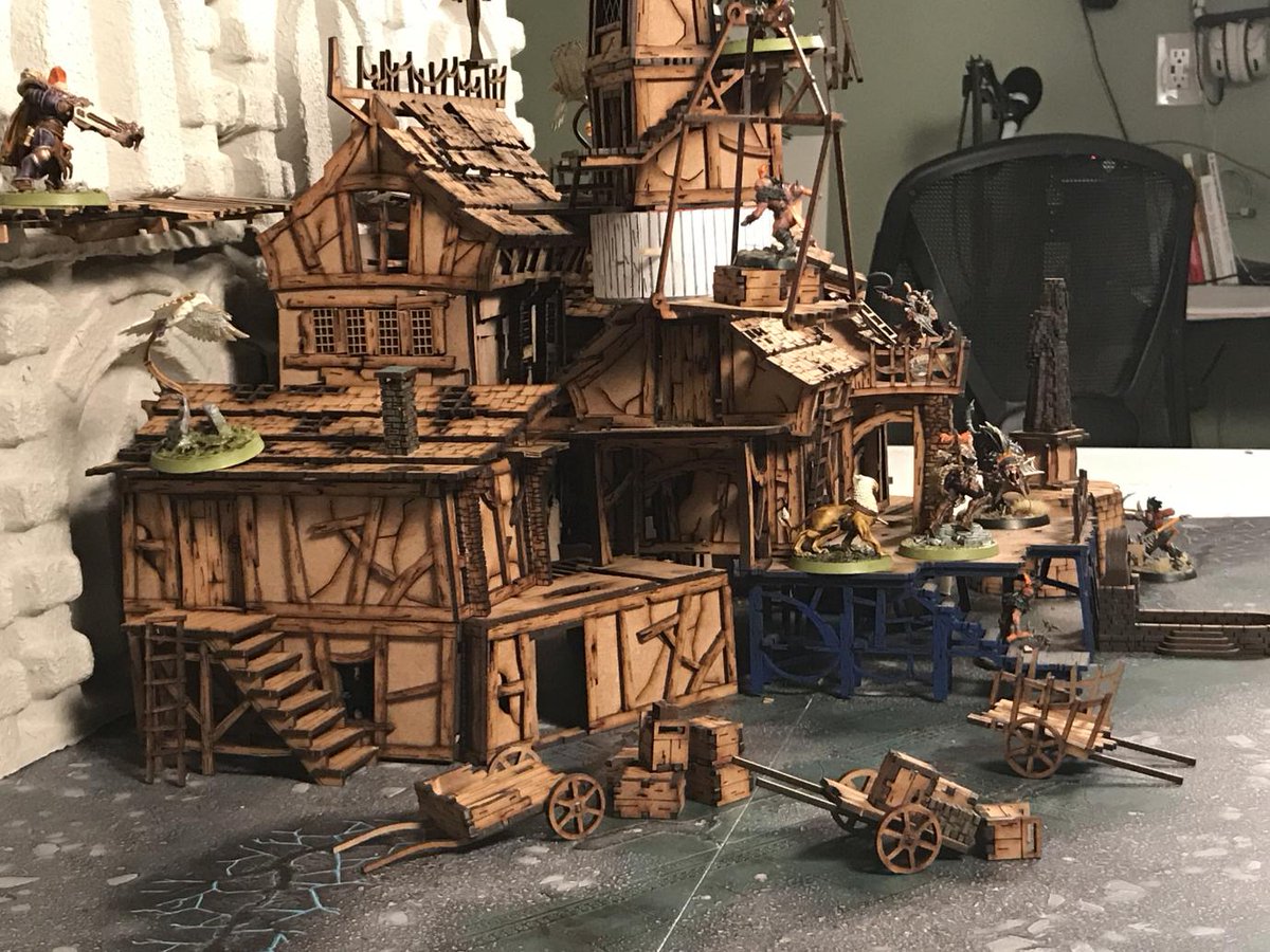 Shanty Town - by  @StoneMonkGamer - Built of MDF kits ( @warcradle) and scratch building the rest from left over scraps. Leaning against the outer wall of a City of Sigmar, this ramshackle outpost lives off the scraps coming out. Not finished, but ambitious  #CircleOfPaint