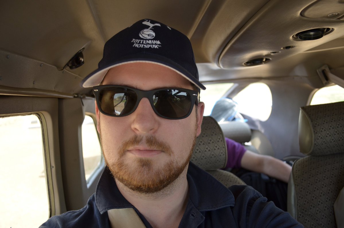 On a trip to Africa I forgot to bring a hat, so I hastily bought one at Heathrow. This nearly ended my promising career because Mike Stratton (Director of  @sangerinstitute; that's his arm behind me in the photo below) is a massive  @Arsenal fan.