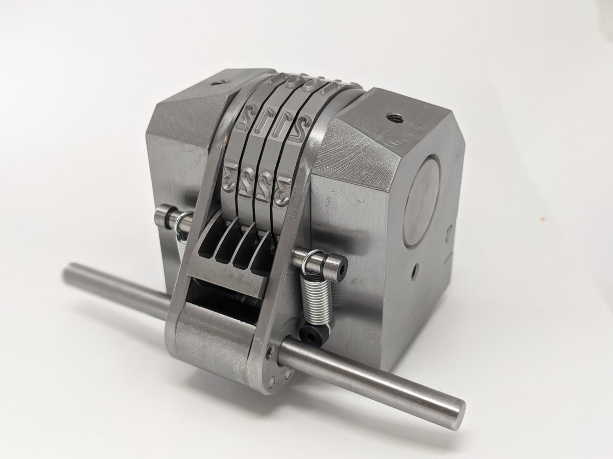 Numberall has just shipped a custom Model 50P for serial numbering.  We had to modify with additional angled cuts, change the return springs from a coil style to an extension style, and put a large character onto a smaller wheel design.  It came out great!  As always Made in USA!