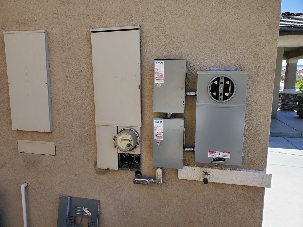 The equipment required to be on the outside of the house. 2 shutoff switches and the extra meter required by SCE.