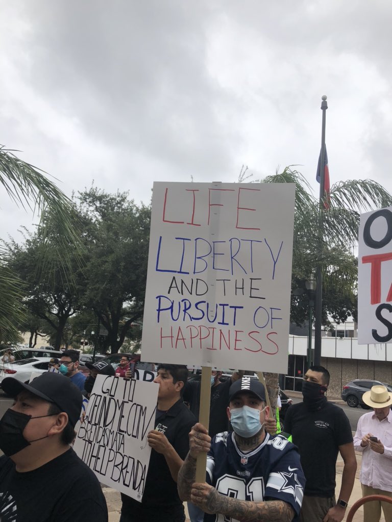 CaryCheshireTX's tweet photo. A couple signs from the #ReOpenTX rally here in Laredo. #txlege https://t.co/vDqXhHTnF5