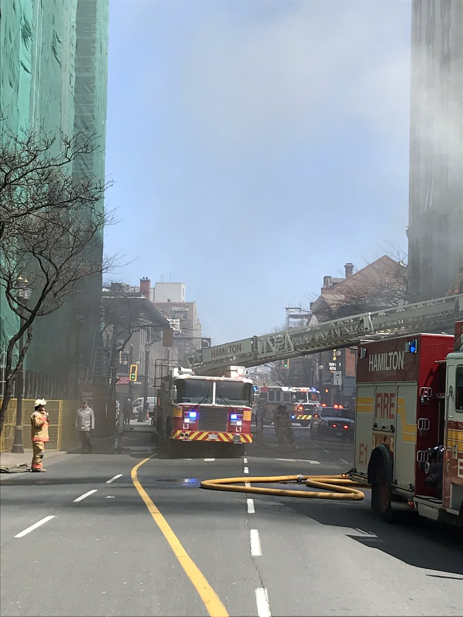 HamiltonFireDep's tweet photo. Crews are active at a multiple alarm at 21 John St. S. #StrongForYou @cityofhamilton @hamiltonfire288 https://t.co/KmgVtZIfmW