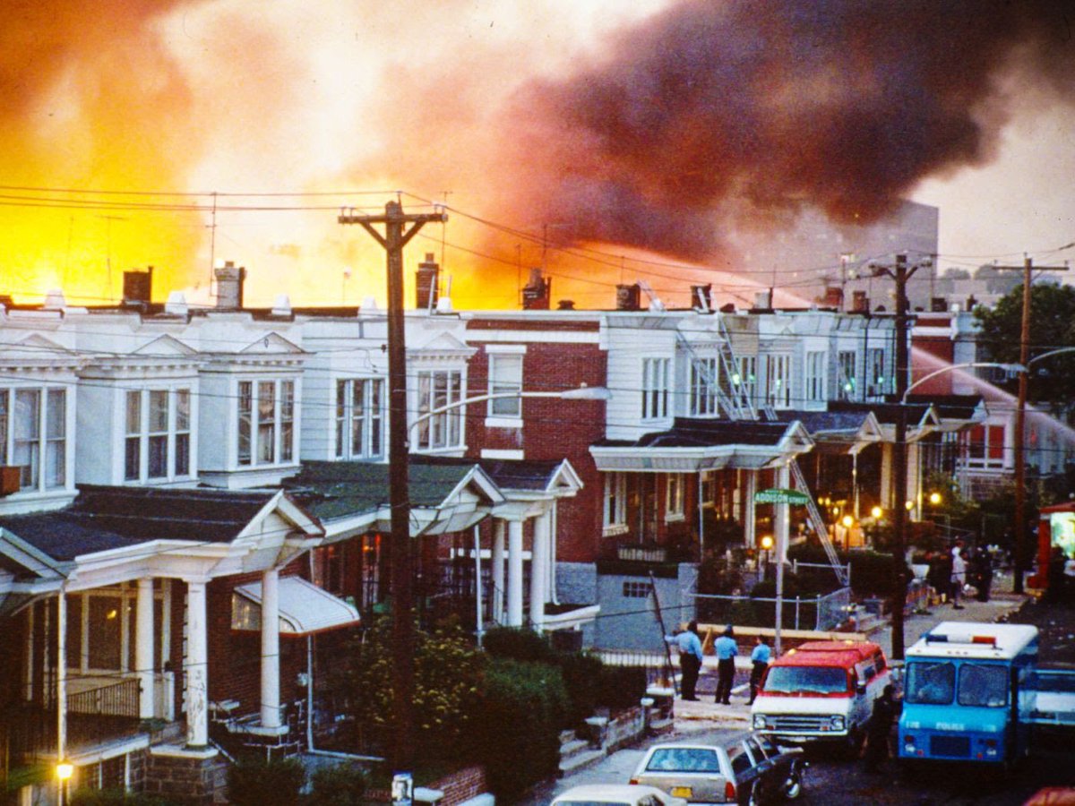 35 years ago today, 500 cops sieged the home of the back-to-nature group MOVE in Philadelphia. They used fire hoses, gas, 10,000 bullets, and finally dropped a bomb that started a fire. The police let the fire burn, killing 11 people, including 5 children.Never forget.