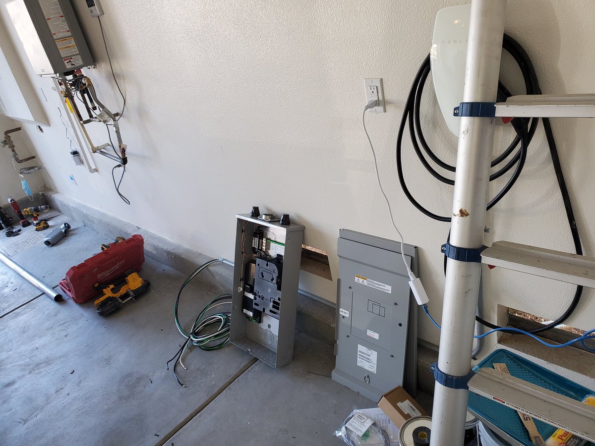Electrician is busy prepping the new sub panel, this sub panel will power the entire house so it's not a small panel. 