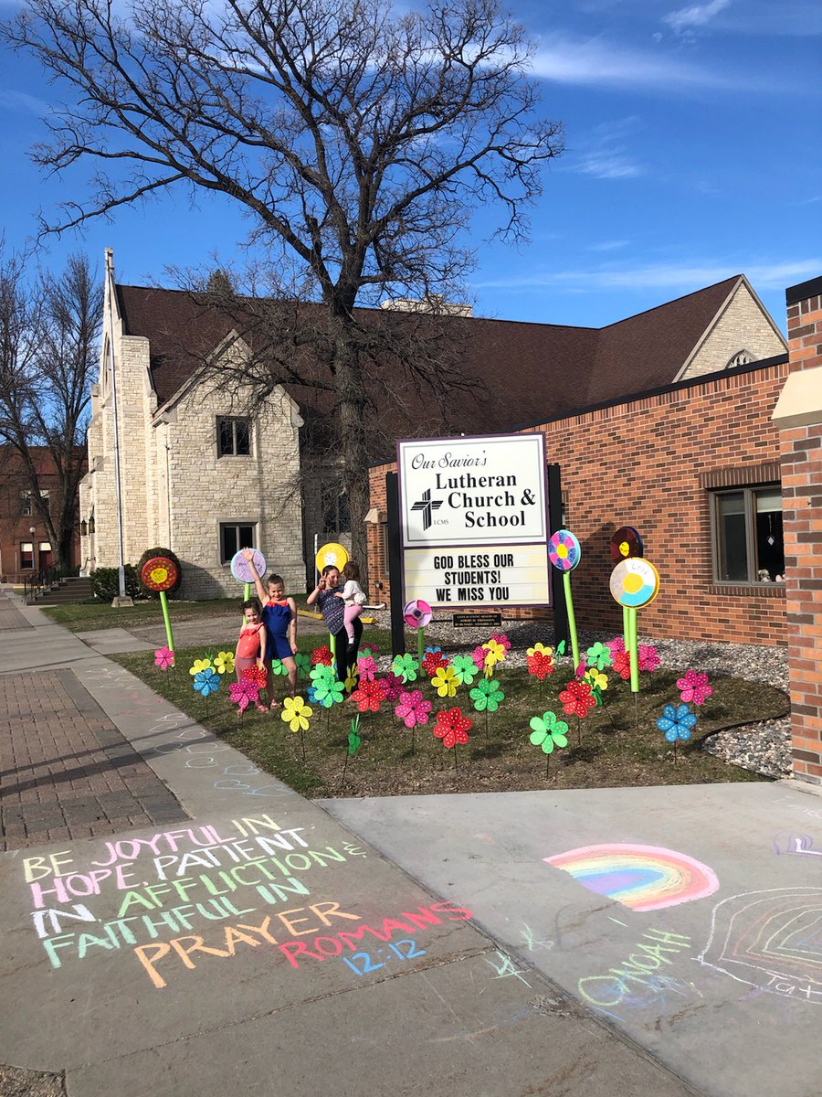 Mnnlcms's tweet image. From Principal Sandra Trittin at Our Savior&apos;s Lutheran School in Crookston. 

&quot;Some of the families in my class helped me decorate our school yard during our distance learning time. The large flowers have the name of each teacher and the small ones are for each of our students.&quot;