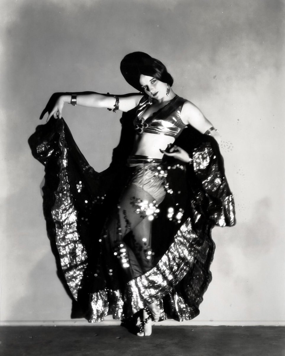 When Louise danced with Denishawn from 1922-1924, the touring company featured “exotic” dances from around the world including a nautch dance performed by the school’s co-founder Ruth St. Denis. A photo of Ruth (L) in costume and Louise later in an imitative pose for Richee (R).