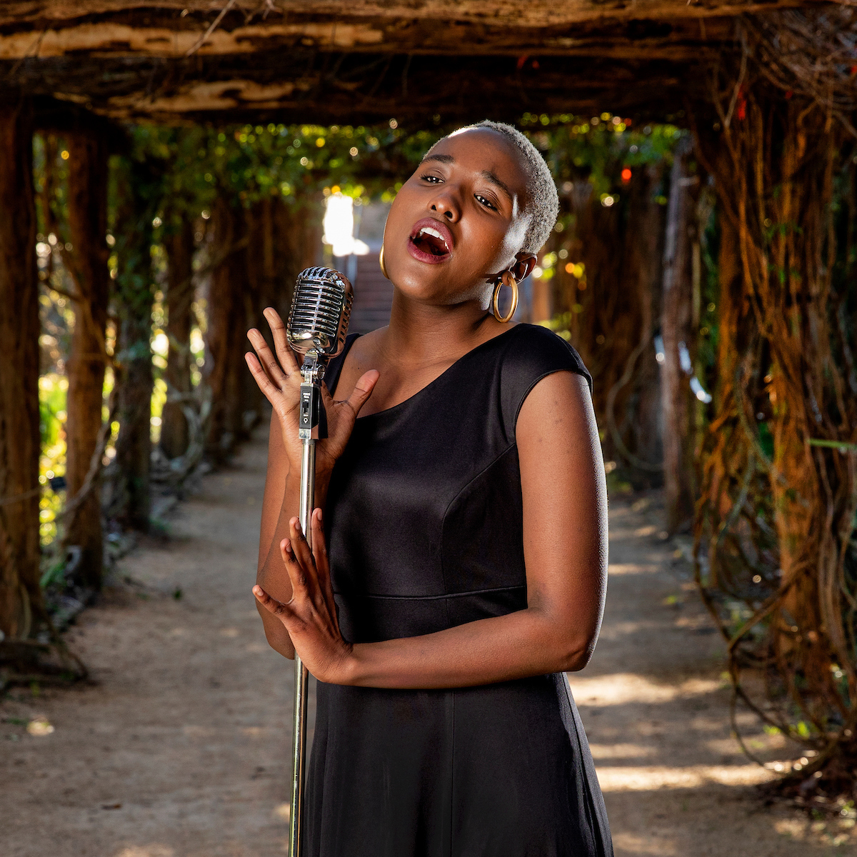 UNC's tweet photo. Now a #UNC alumna, Faith Jones says singing makes her the happiest. "I also notice that it makes other people happy. It’s great to just have a life of music and I’m blessed to be able to do so." 🎶 https://t.co/iut9tfindL