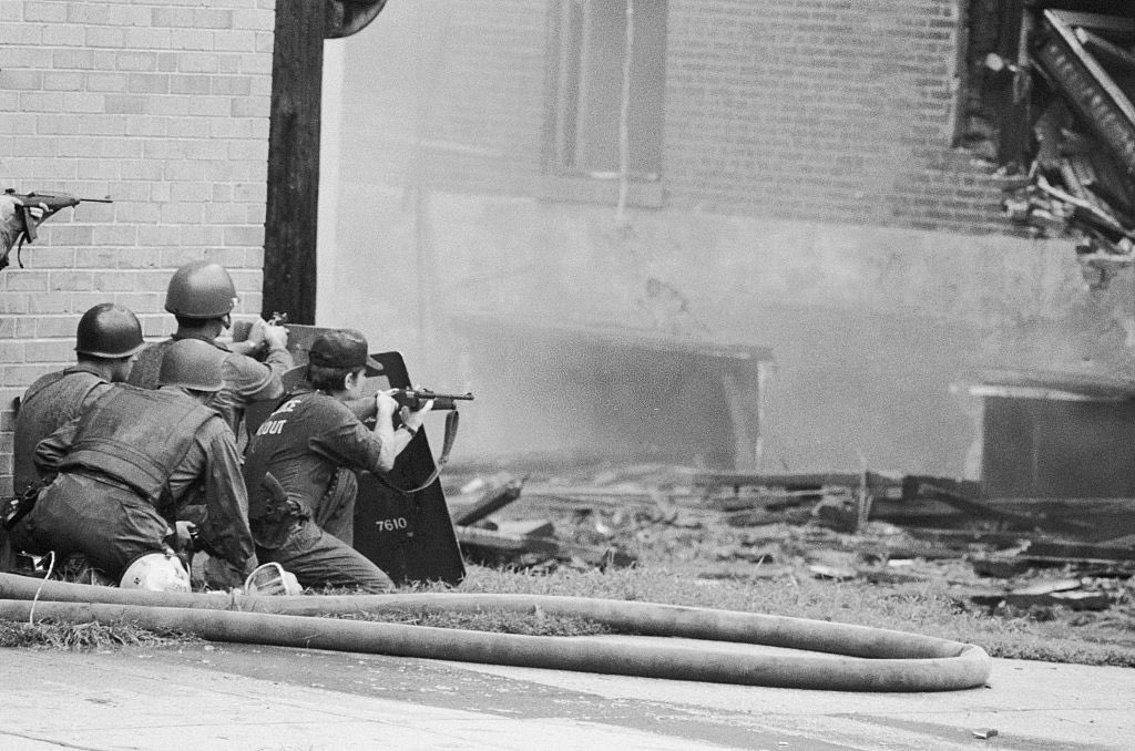 After over a year, police are ordered to raid the MOVE building on Pearl Street in Spring of 1978. The standoff results in one dead police officer, muliple police/firefighter injuries, and nine MOVE members arrested.