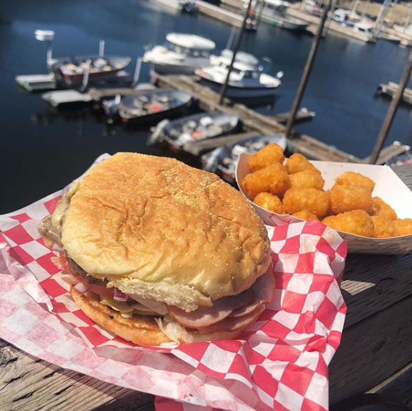 KnudsonCove's tweet photo. The Burger Shack weekly special is a Hand Troller Burger and small tots for $10.95 ! The hand troller has Ham, cheese, lettuce and tomato 🍔✨ https://t.co/u0iRGZpFGM