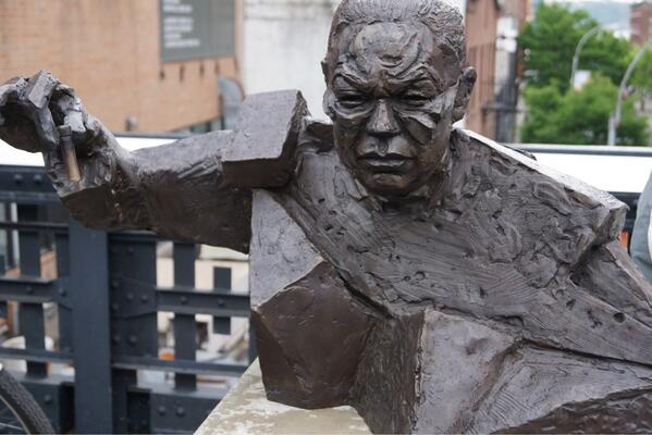 Colin Powell in New York city. If it serves the same purpose as a gargoyle, I approve and well done by the artist!