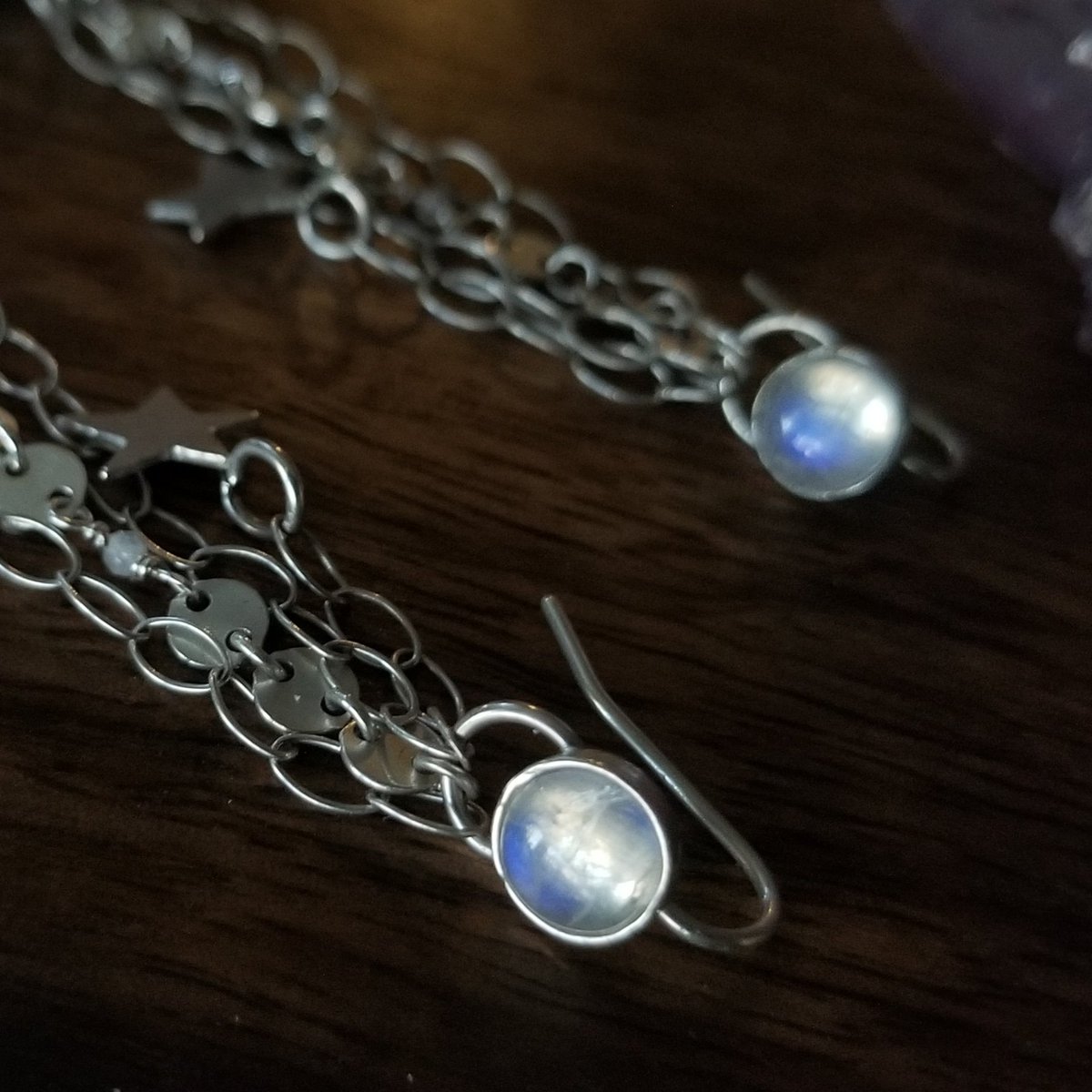 BLaceJewelry's tweet photo. Just finished up these custom earrings! I love the blue flashes in these moonstones- they pair perfectly with the celestial theme of the earrings. 💙 🌟
#jewelry #earrings #nofilterneeded #celestial #stars #artist #Silver #sterlingsilver #jewelrydesigner
 https://t.co/JOeP5zj2PW https://t.co/6SjIwNsCfm