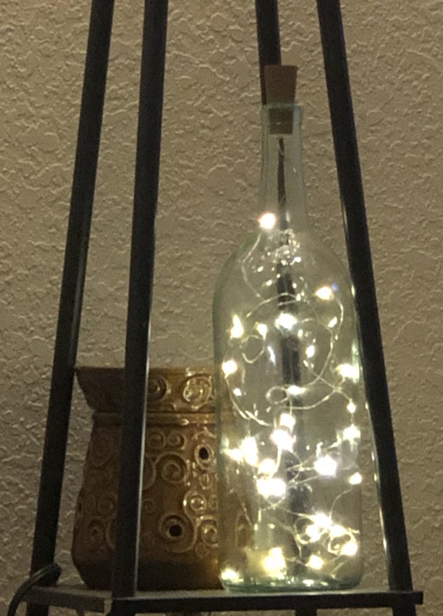 Added a wine bottle light to my shelf in my living room.  💓💓💓