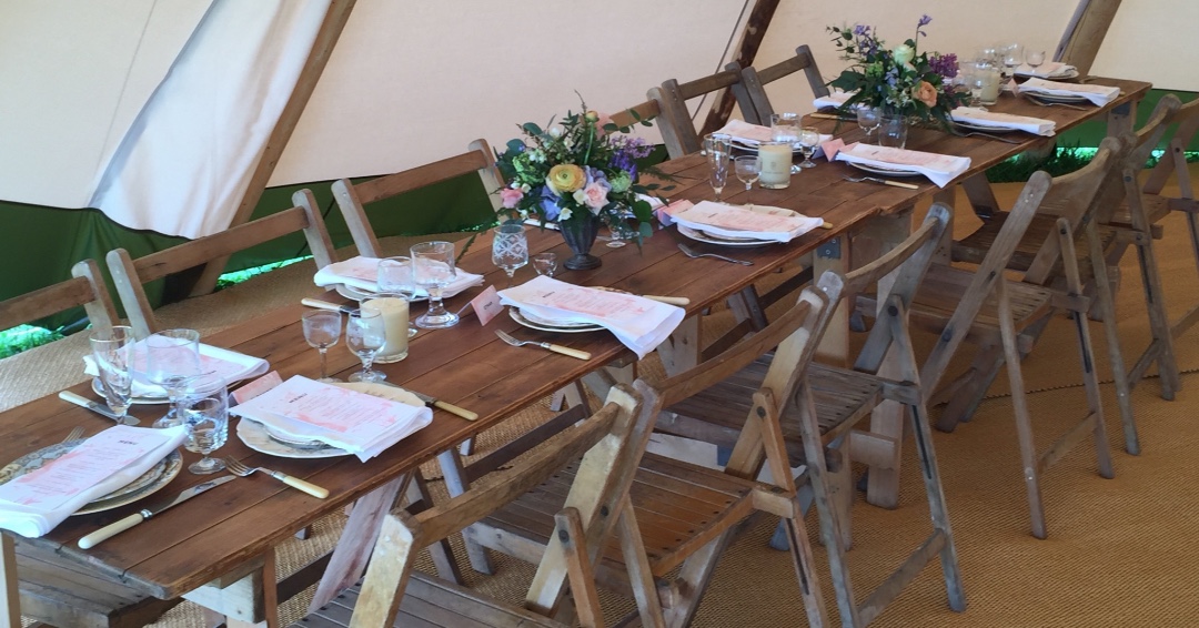 Elegant rustic charm, ideal for your #wedding or #specialoccasion. Beautiful reclaimed timber tables and vintage style folding chairs. Perfect! #tipiwedding #whitetipis #rusticstyle #elegant #tipihire #makatipi #nordictipis #furniturehire #vintagehire #weddinghire