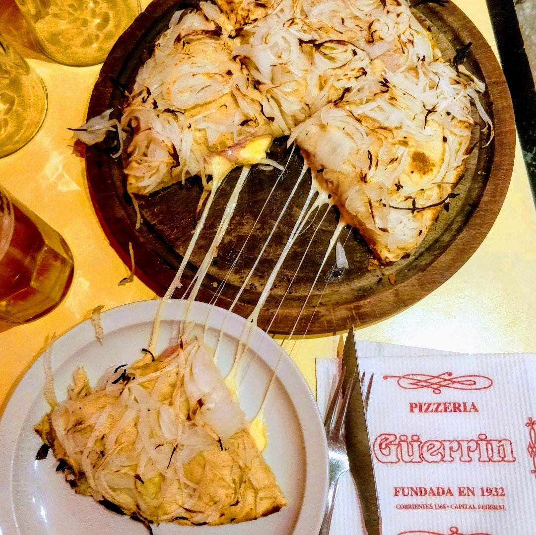 It's #TBT and I'm throwing back to this "Fugazzeta" in Buenos Aires which blew me off my seat. Everything from the food to the service at Pizzeria Guerrin is an experience you won't forget.