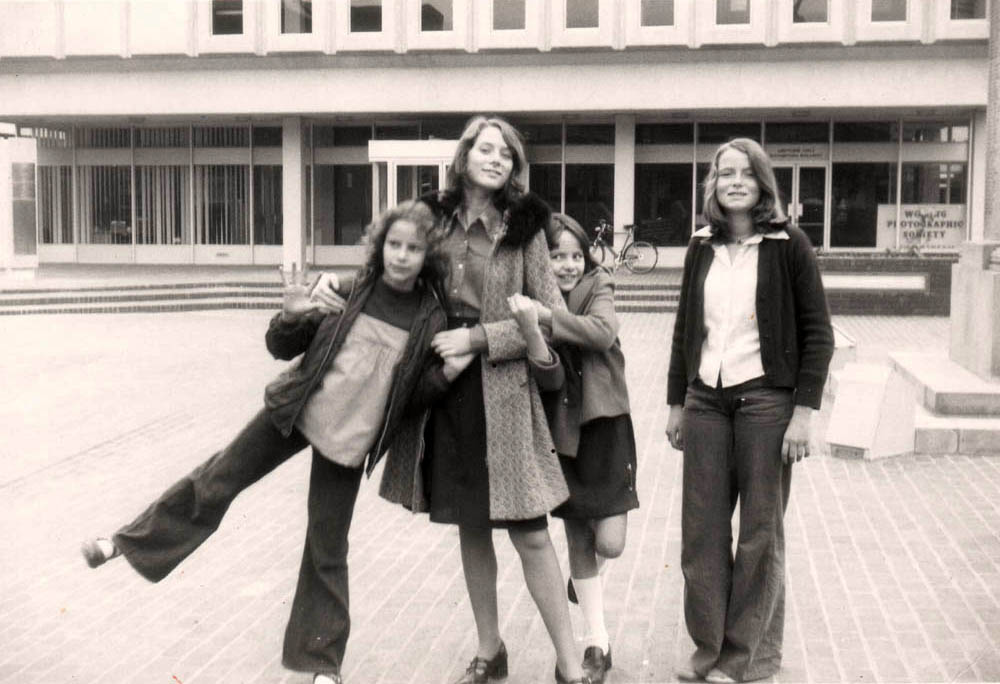 Kikishua's tweet photo. #SurreyDay #WokingLibrary Throw back to 1975, four sisters outside an important town landmark https://t.co/nLRF5DaL7N