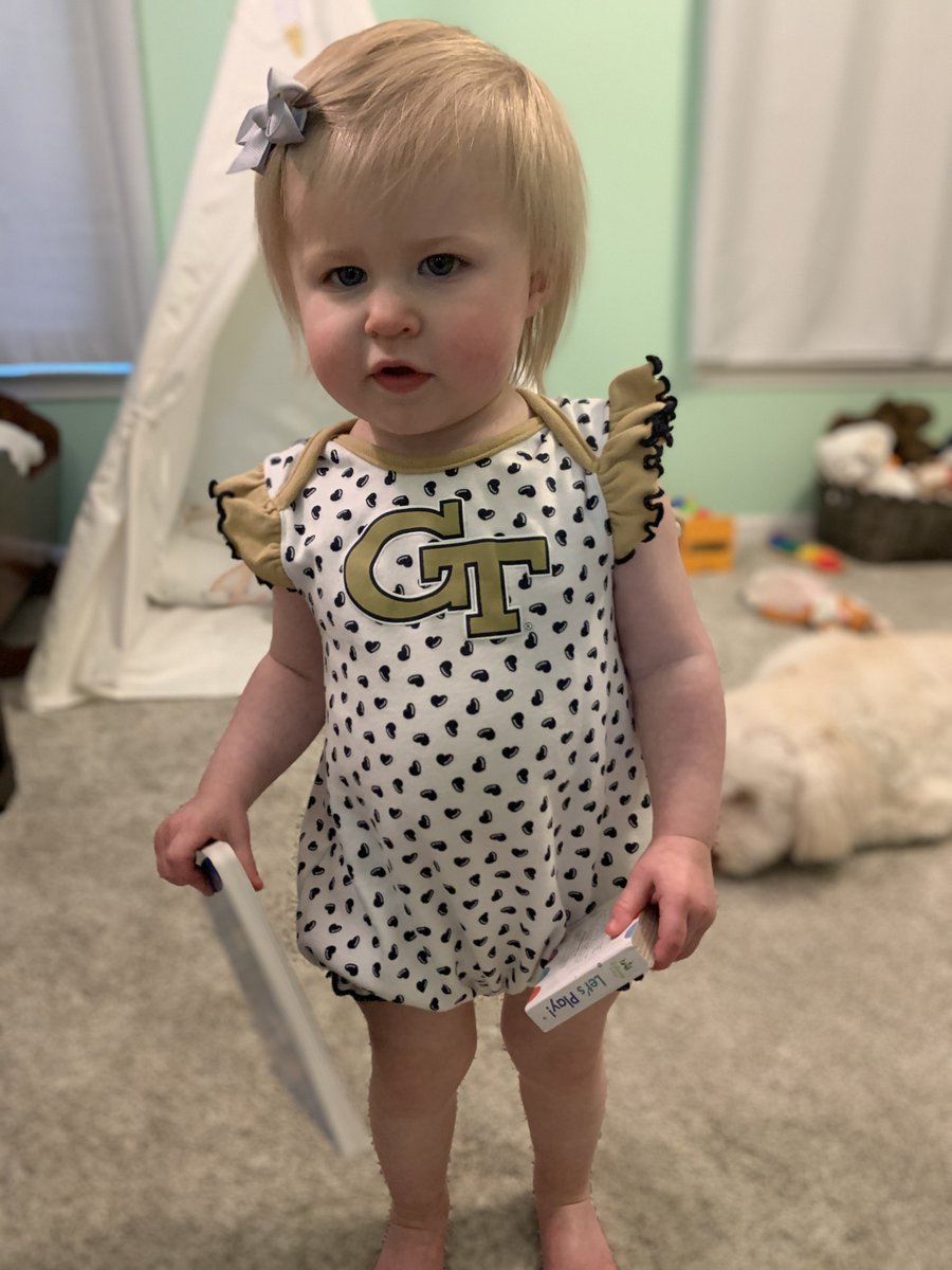 BravesCallie's tweet photo. Future #GTGrad right here reading about space. I put the book facing towards me, she usually reads right side up. 😂 #GoJackets Also, the second picture is the face she made when I said we could read one book. Girl loves to read. https://t.co/fdkLfRr3MB