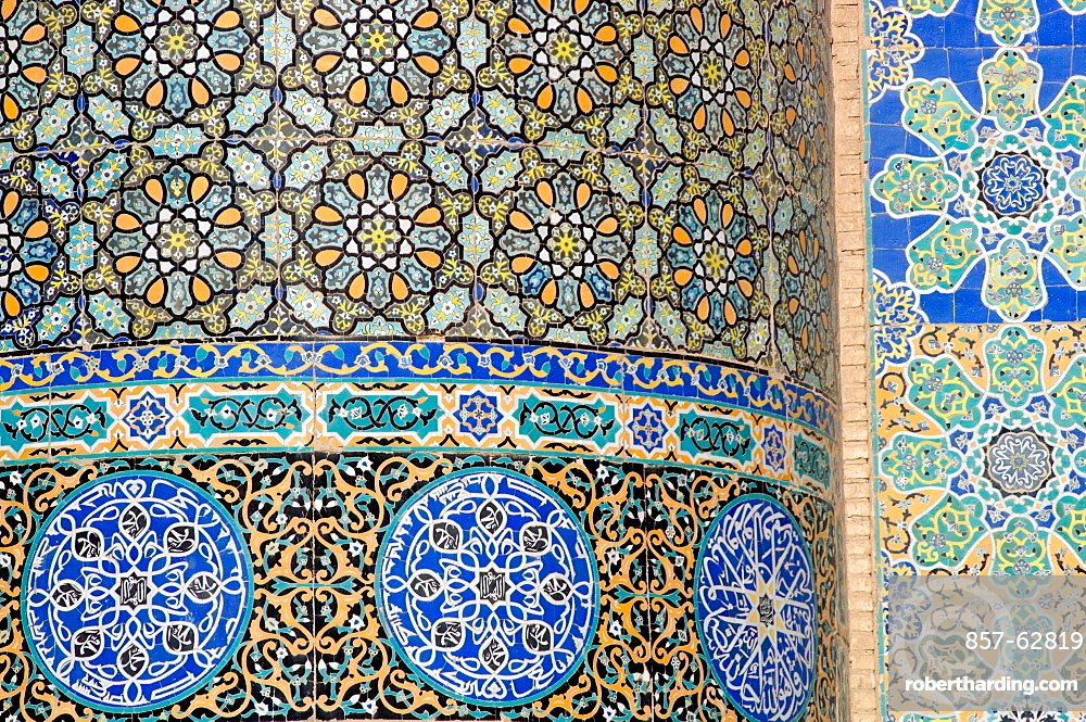 Floral & geometric patterns of restored tile mosaics decorate a wall in the courtyard of the Friday Mosque in Herat. Much of the Ghorid and Timurid decorations on the mosque had been badly damaged during the centuries, but a restoration project begun in 1943 continues today.