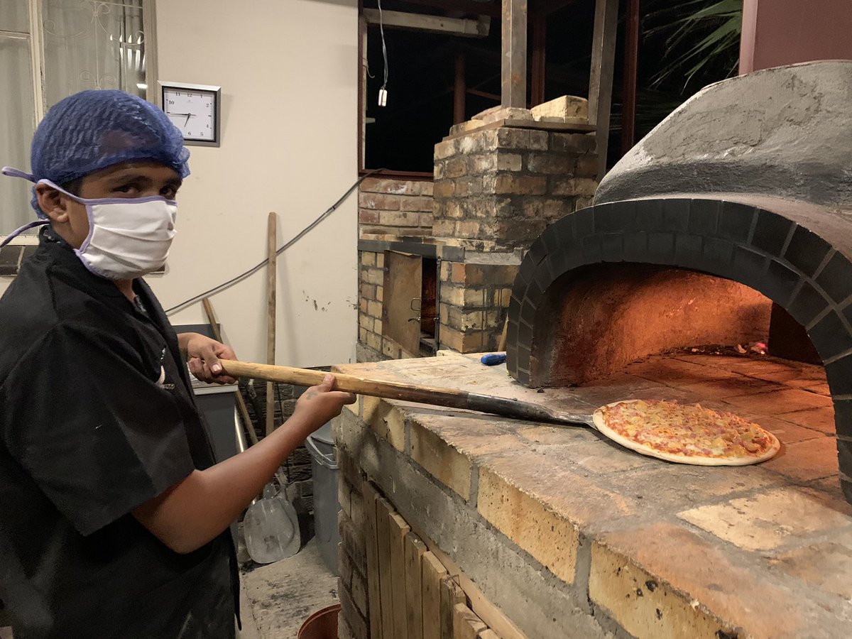 begottensun's tweet photo. Jared is only 17 and a master at the Stone Oven Pizza. Can cook 16 pizzas in the oven at one go! https://t.co/zGLSs8qkMw