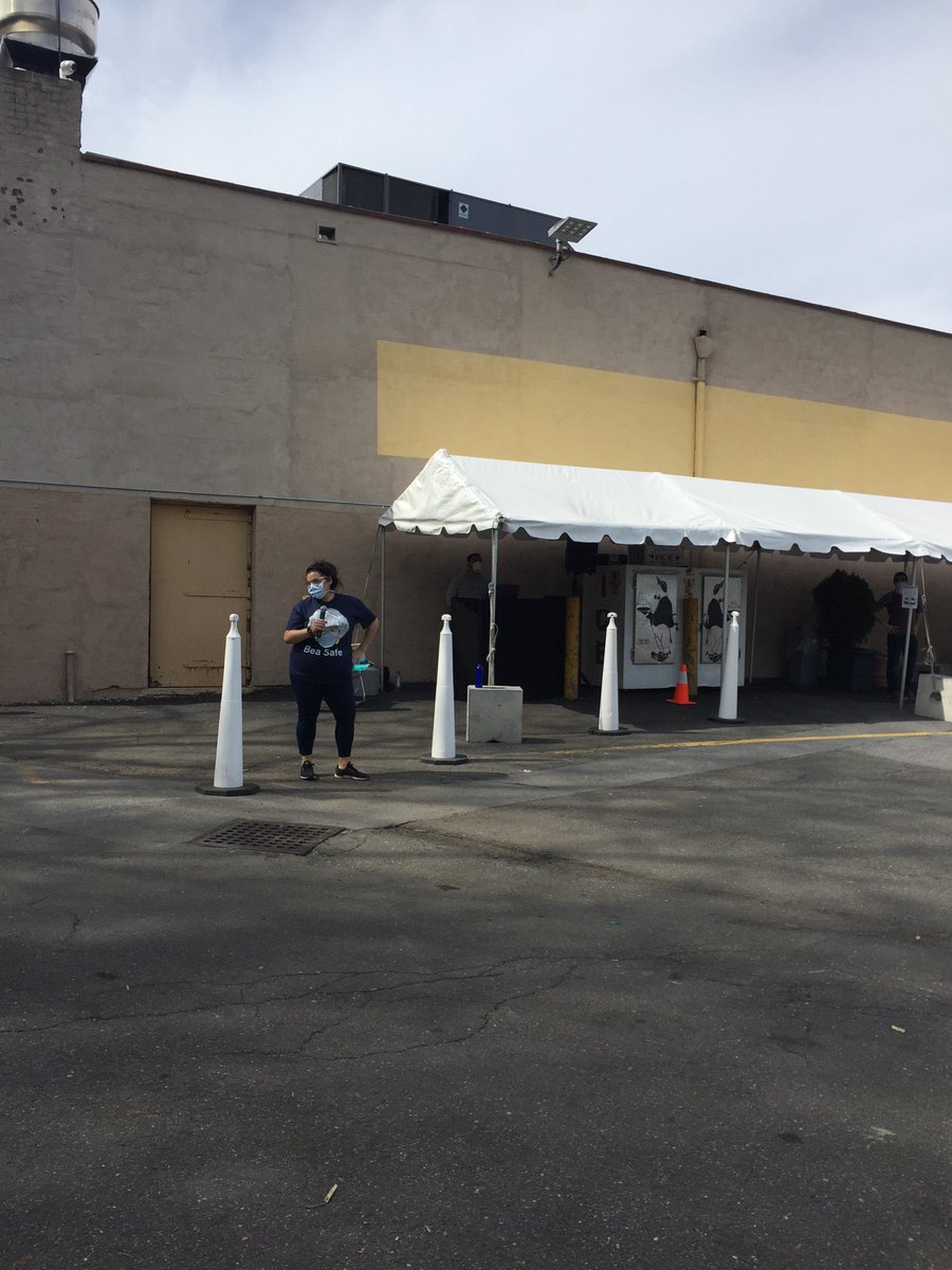 pennycrosman's tweet image. My local grocery store has a DJ in the parking lot and an attendant is trying to get the people on line to dance #SocialDistancingFun